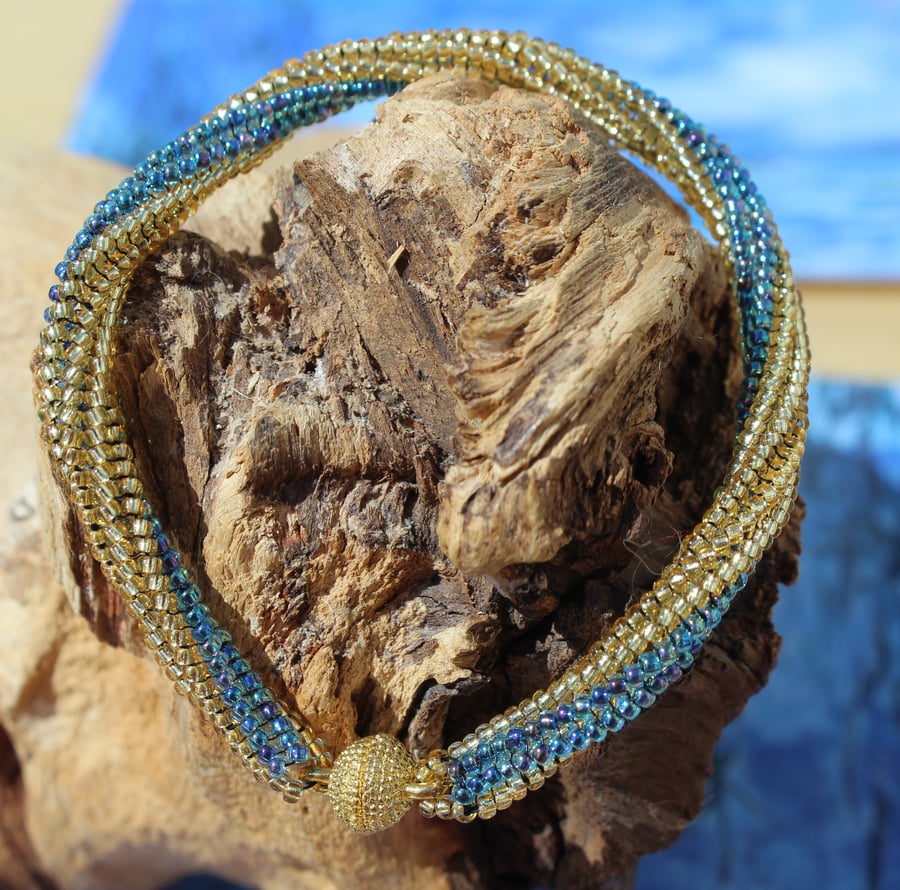 Gold and blue seed beaded twisted bracelet with magnetic clasp