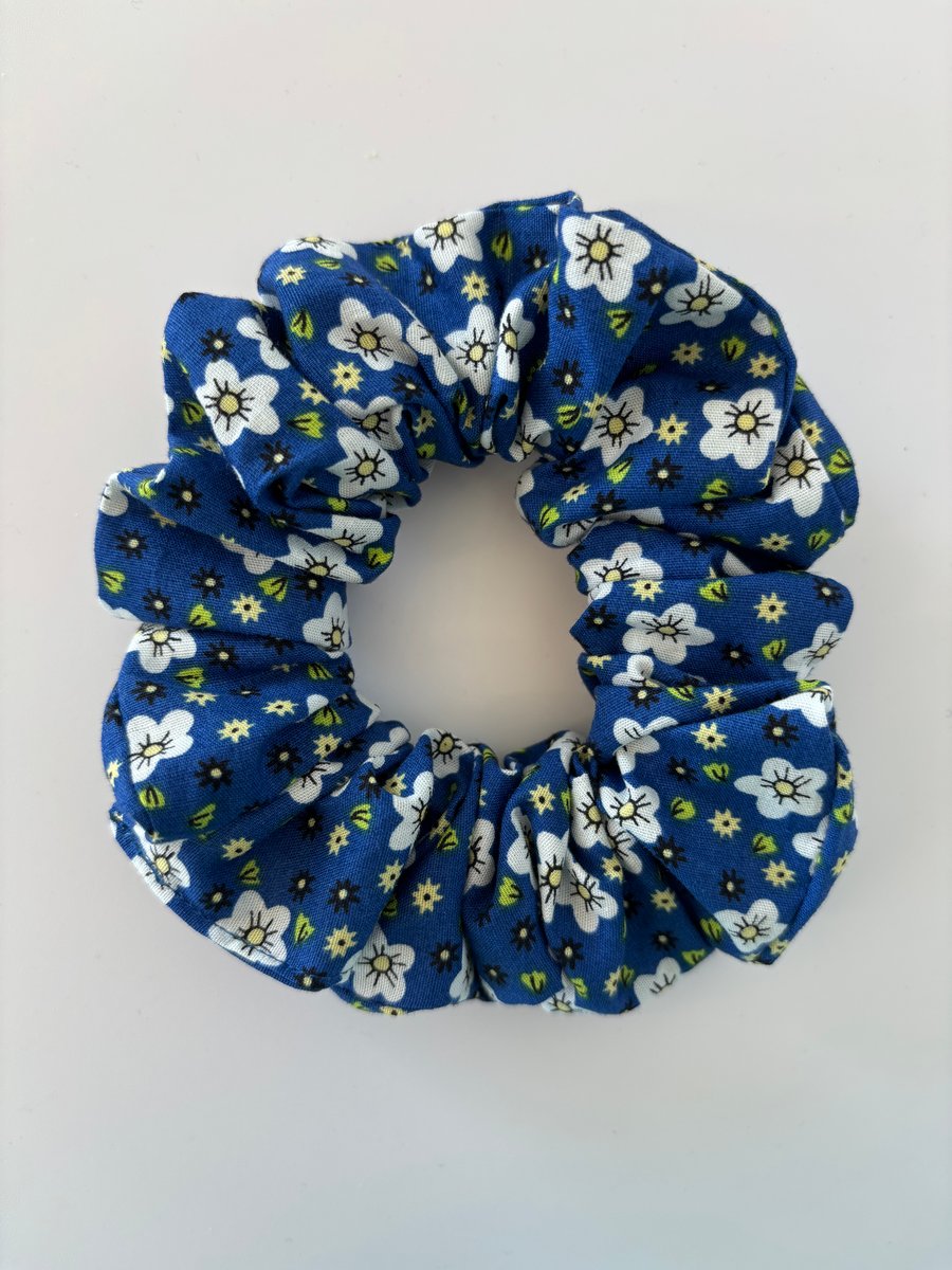 Cotton scrunchie hair accessory in a blue and white floral print.