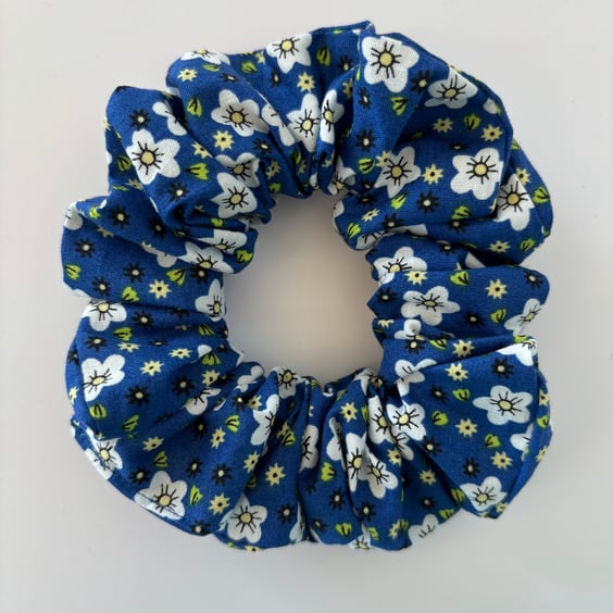 Cotton scrunchie hair accessory in a blue and white floral print.