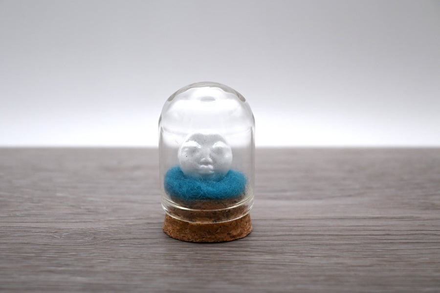 small glass glitter man in the moon figure