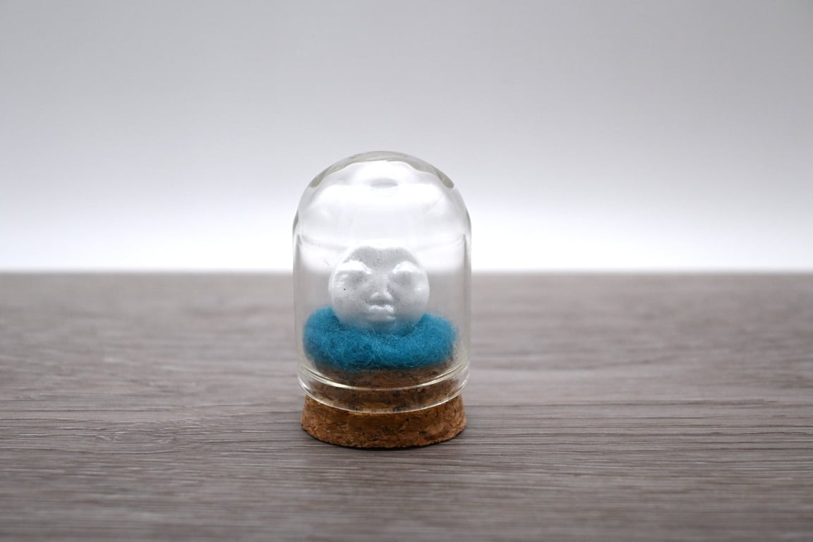 small glass glitter man in the moon figure
