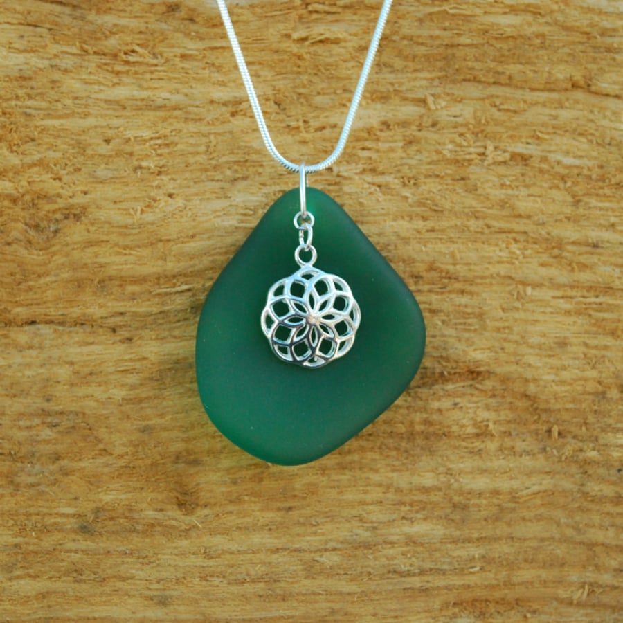 Beach glass pendant with Celtic flower charm
