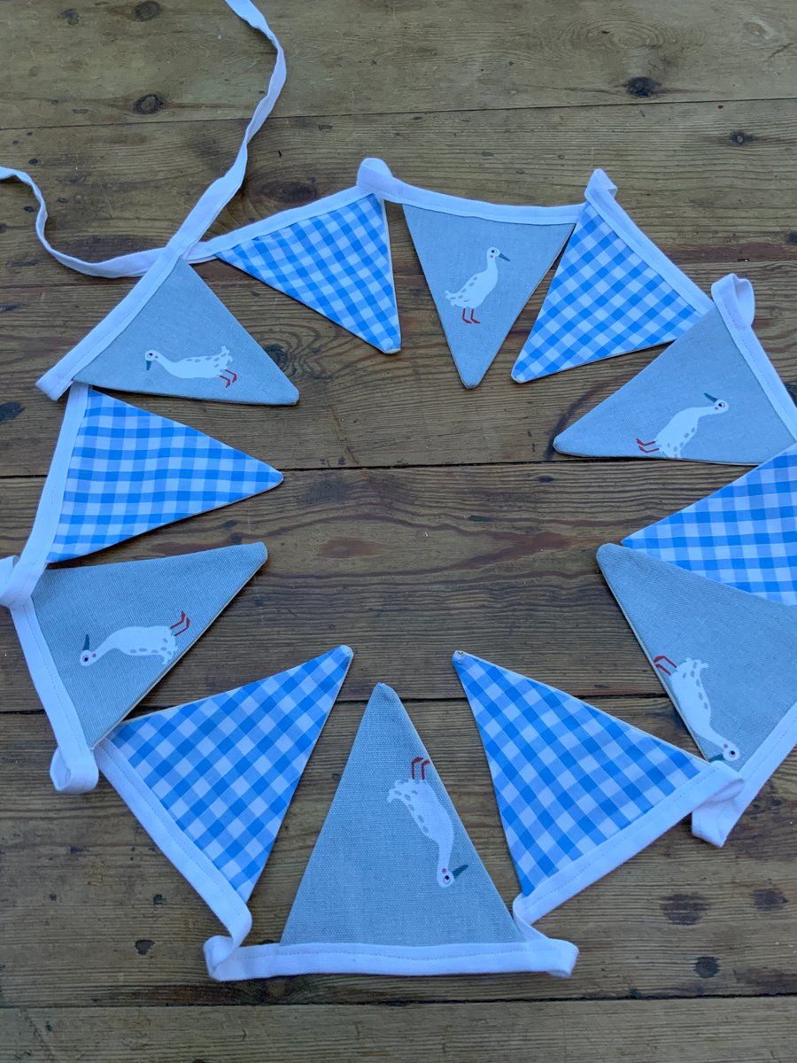 Sophie Allport Runner Ducks with alternate blue white fabric bunting. 12 Flags 