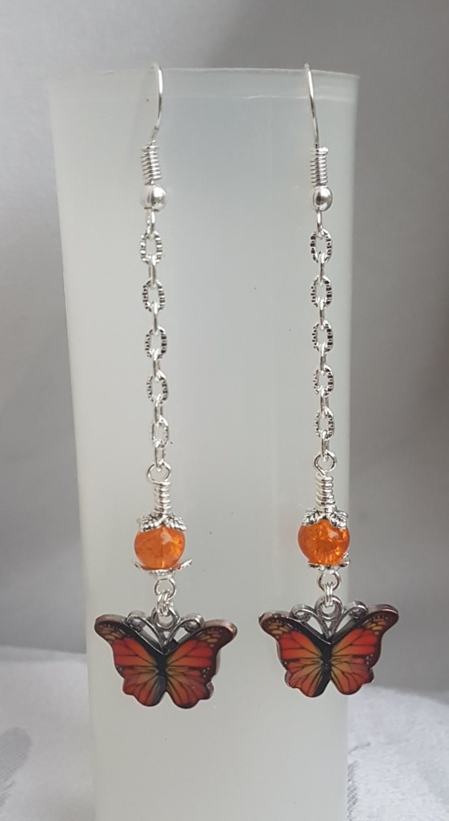 Gorgeous Dangly Orange Butterfly Earrings - Silver Tones.