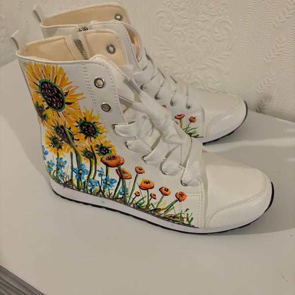 A pair of hand painted and sealed boots by Andrew Jenkins 
