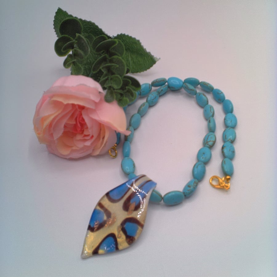 Blue and White Glass Pendant with Gold Flecks on a Turquoise Bead Necklace