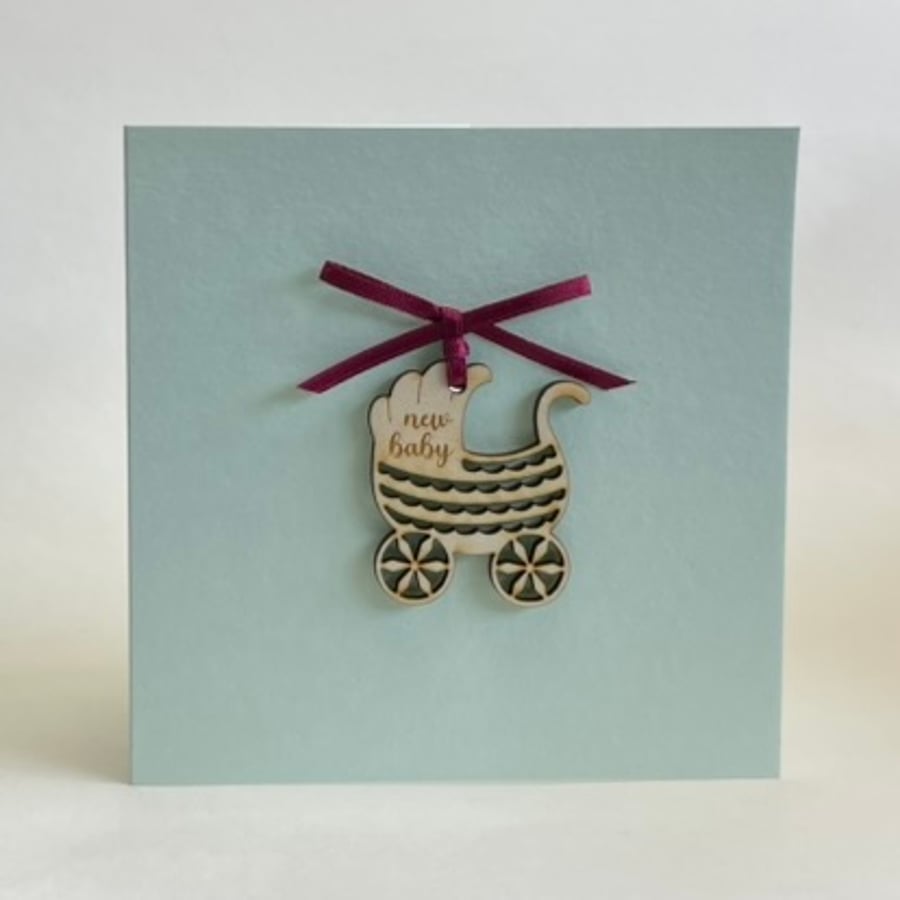 New baby card with detachable pram decoration