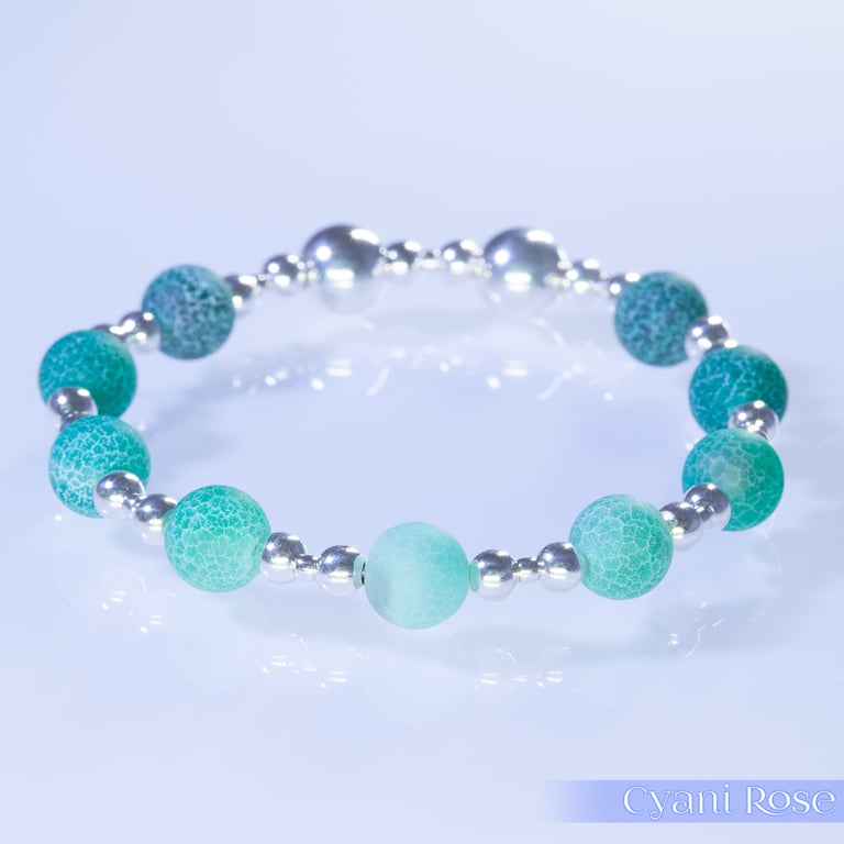 Beaded bracelet with crackle glass and sterling silver green blue stretchy