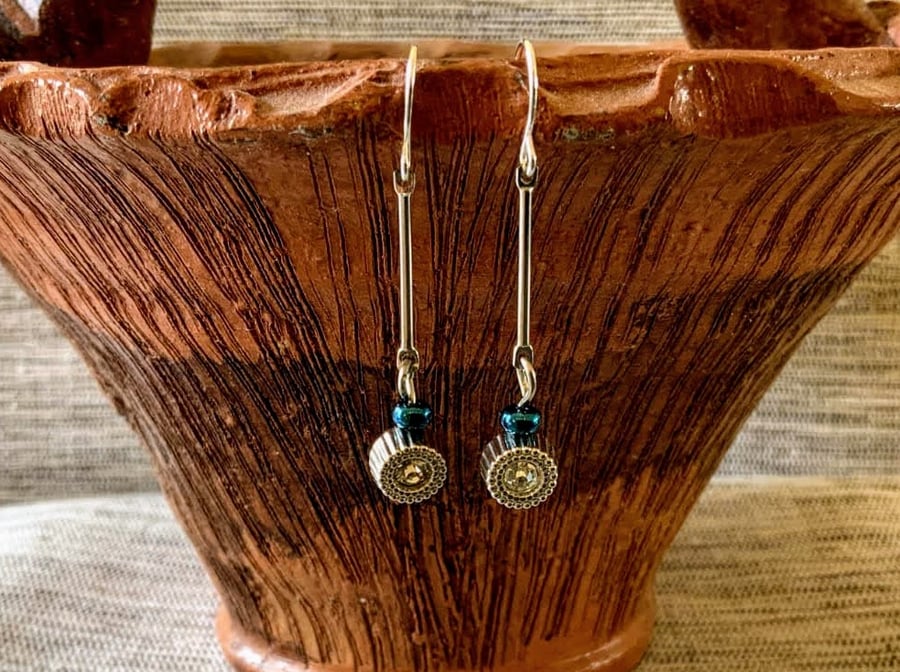 Simulated diamond long pin earrings.