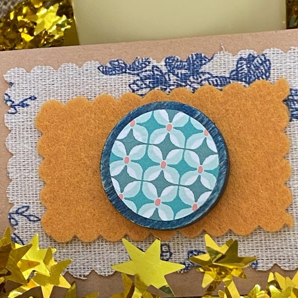 Wooden pin with a repeated floral pattern for Christmas stocking filler