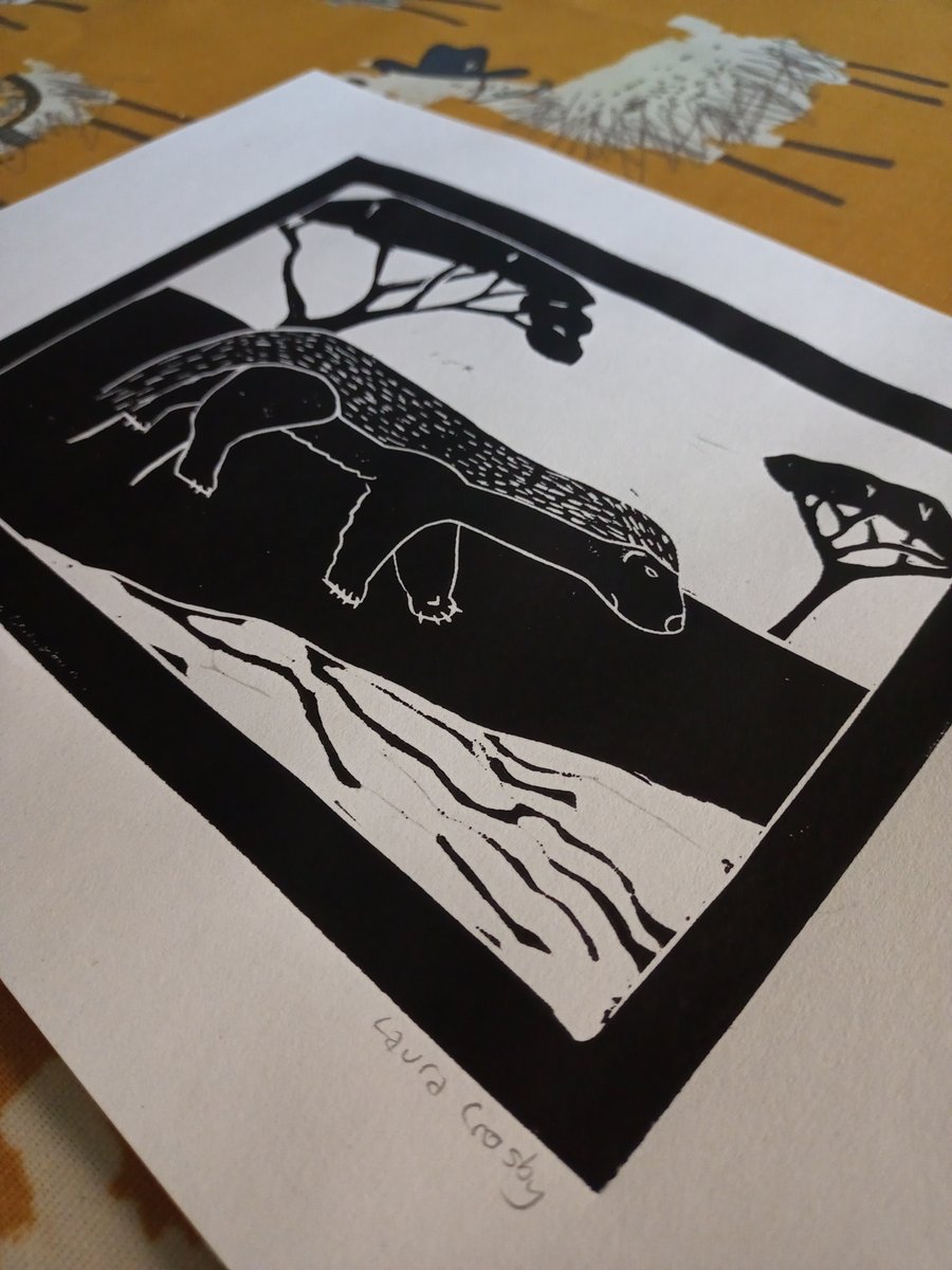 A4 lino print of honey badger on recycled paper (black on white)