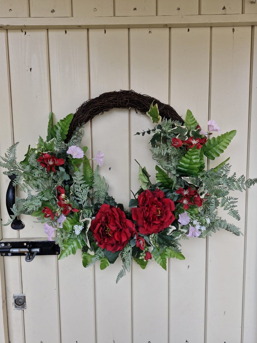 Tommy. Half covered wreath, bespoke, floral.