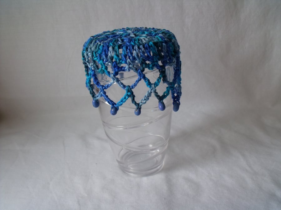 vintage style crocheted beaded doily jug cover to repel bugs when outdoors 