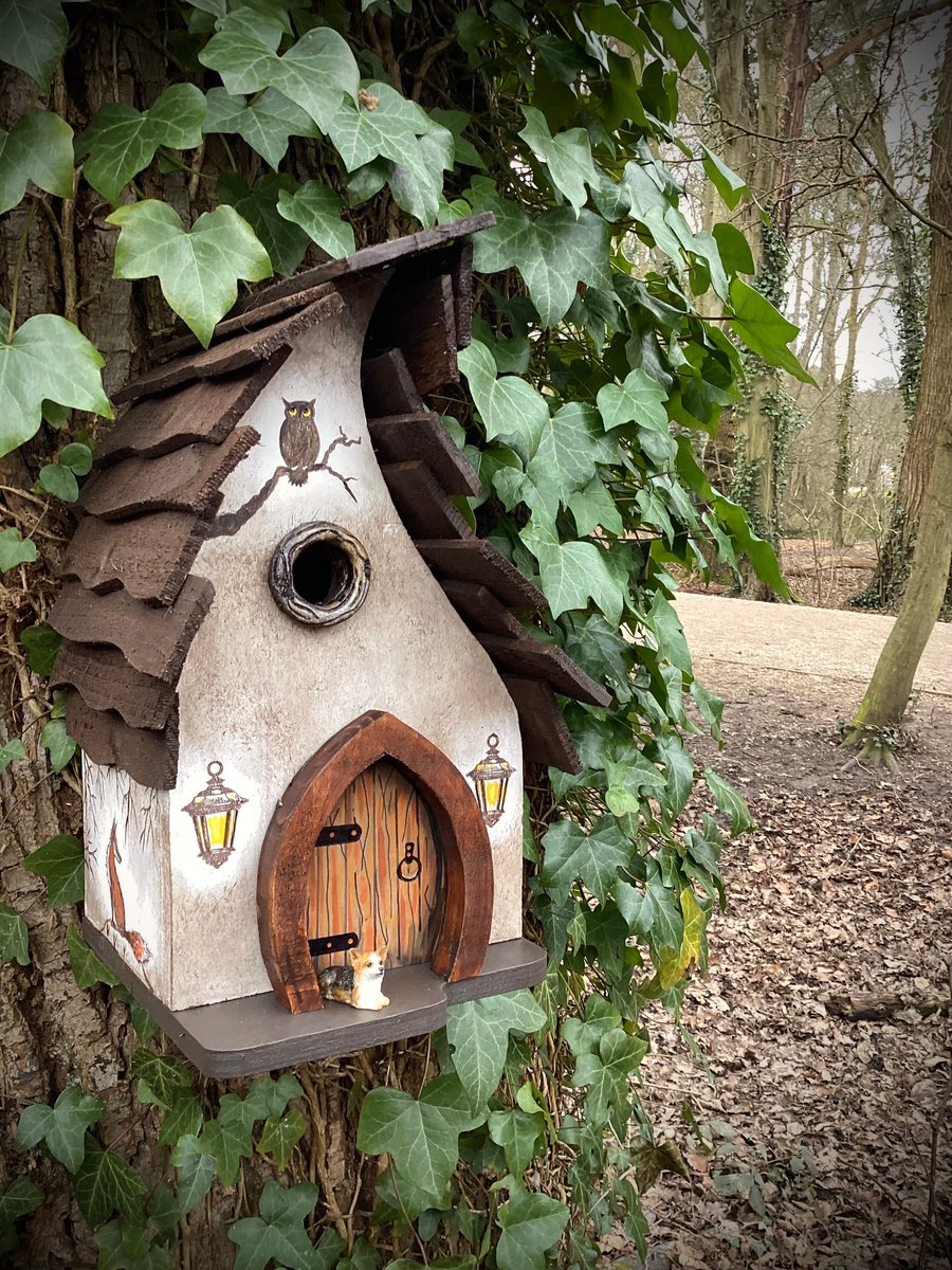 Rustic wooden birdhouse whimsical touch.