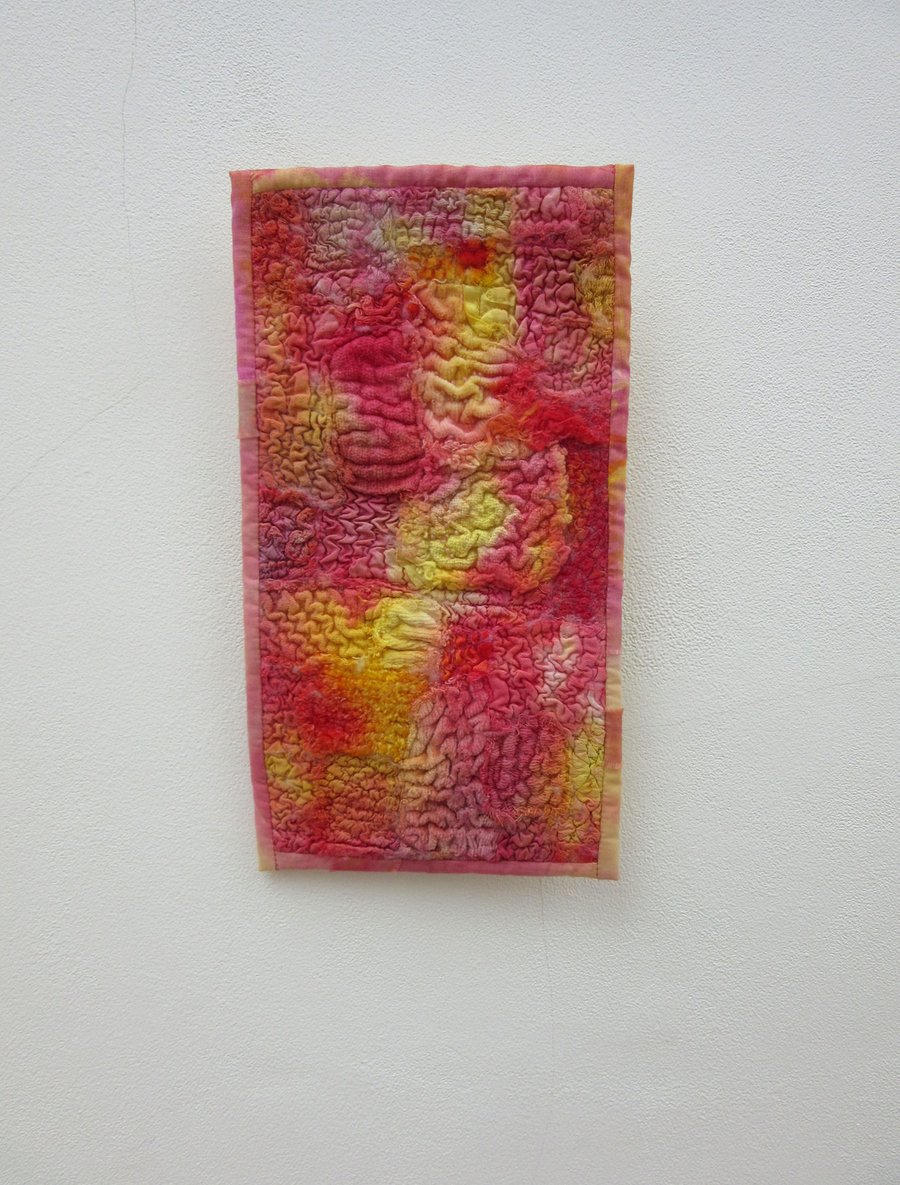 Brightly coloured wall hanging. Abstract fabric picture