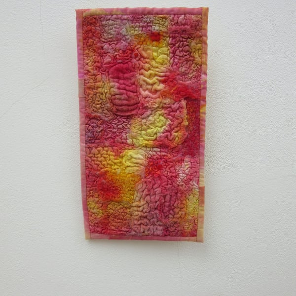 Brightly coloured wall hanging. Abstract fabric picture