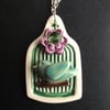 little ceramic bird cage necklace with flower button and bead