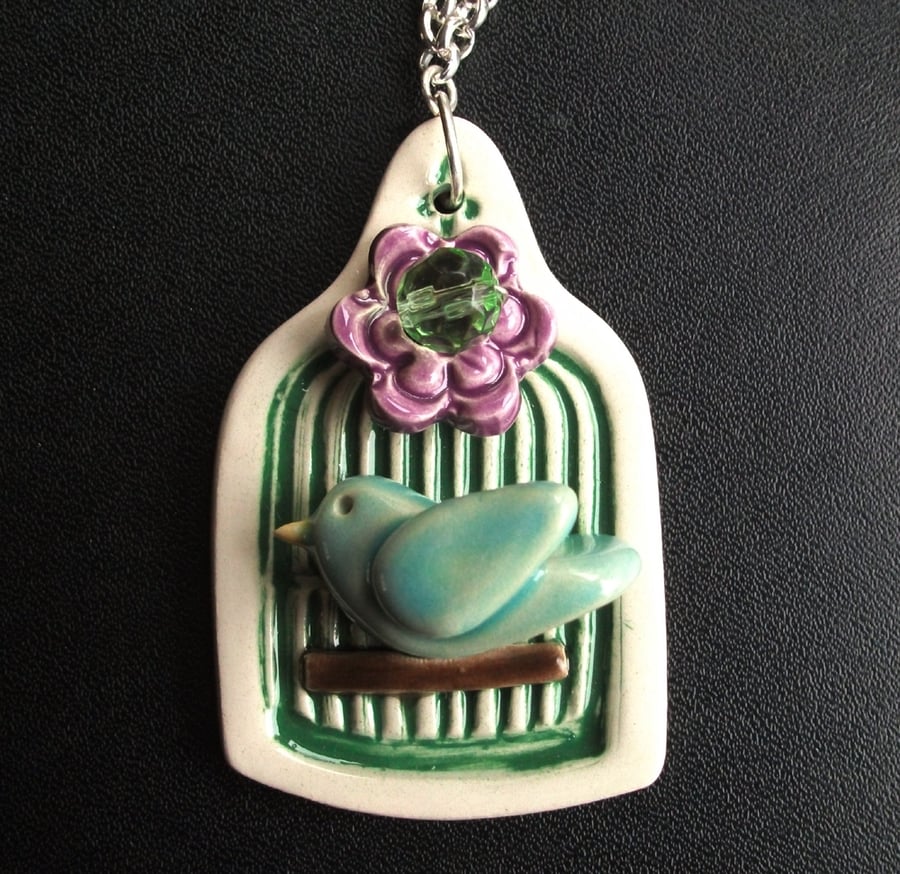 little ceramic bird cage necklace with flower button and bead