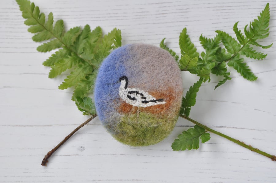 Avocet embroidered brooch on needle-felted background