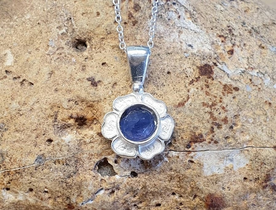 Tiny Tanzanite flower pendant. December birthstone.