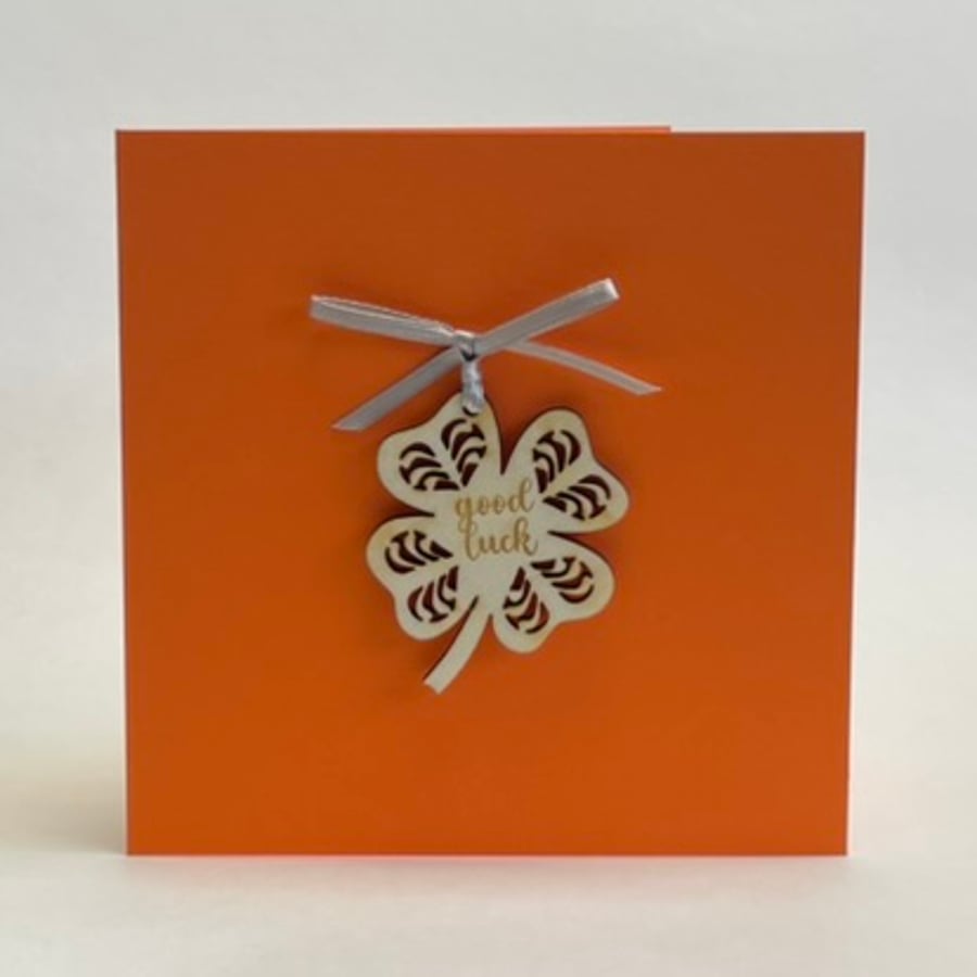 'Good luck' card with detachable decoration
