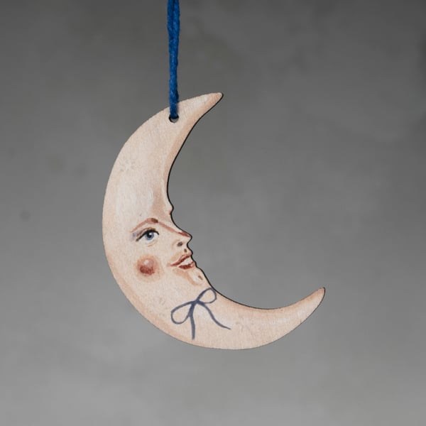Wooden decoration of a crescent moon called Apollo. Double sided