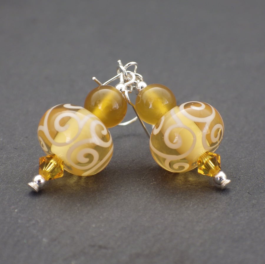 Yellow swirling UK lampwork glass bead earrings with carnelian