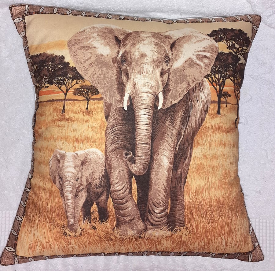 On Safari Elephant and calf walking across grassy plain cushion