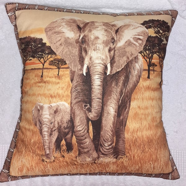 On Safari Elephant and calf walking across grassy plain cushion
