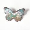brooch: butterfly - scrolled pink aand white over turquoise on clear enamel