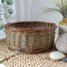 A round handmade willow basket with a Catalan style base.