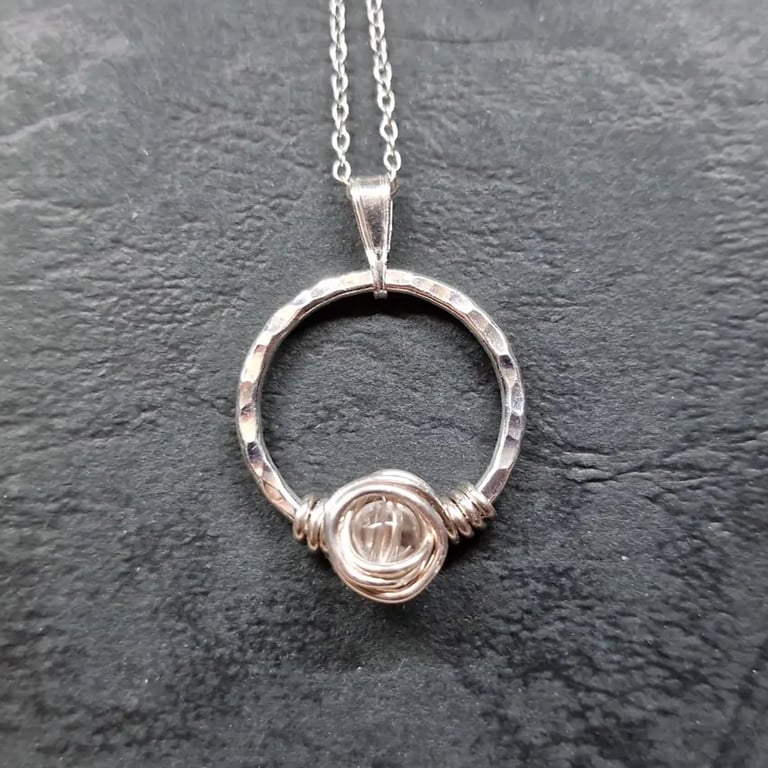Silver hammered circle quartz pendant. April birthstone. Reiki jewellery