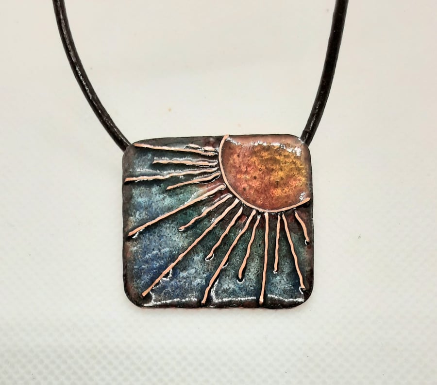 Sunburst enamelled square pendant on leather