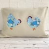 Chickens cushion with two pale blue floral and polka dot chickens