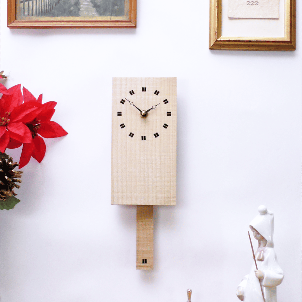 Wooden Pendulum Wall Clock in ripple sycamore & inlaid ebony Squares