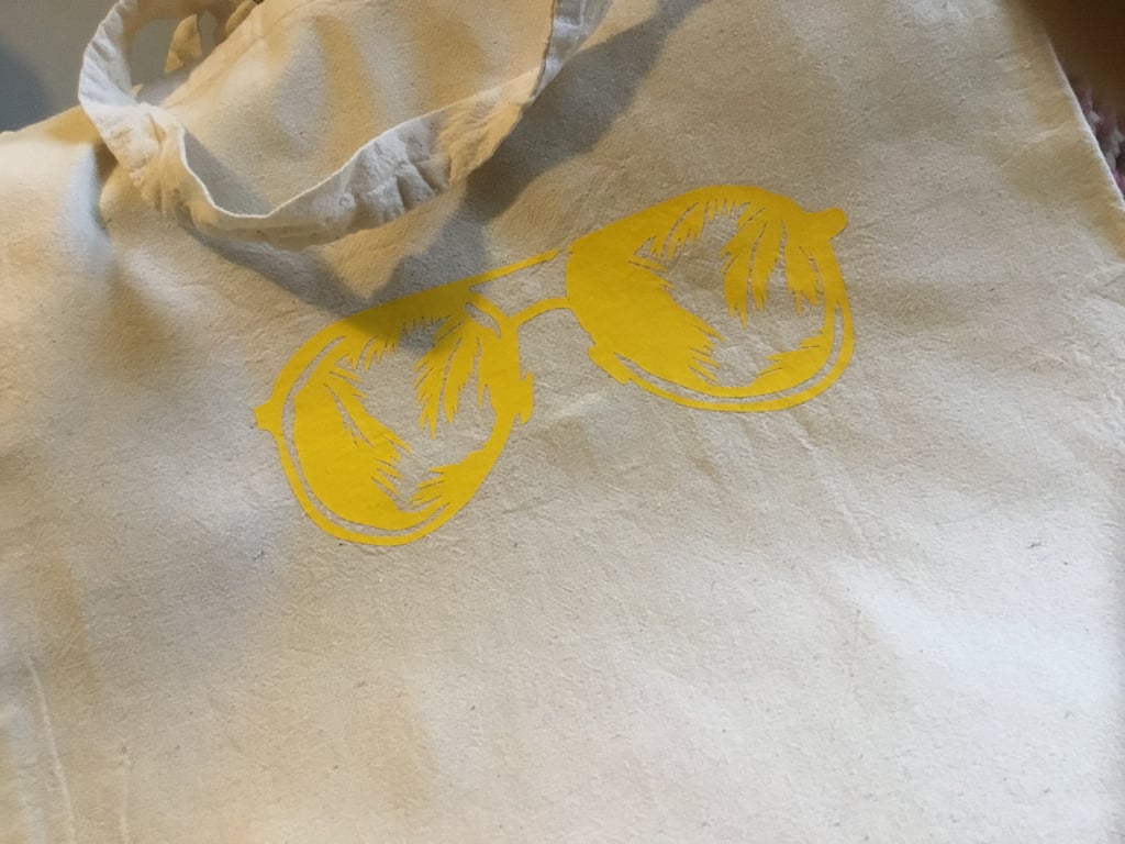 Tote bag. Sunglasses. Reusable tote bag