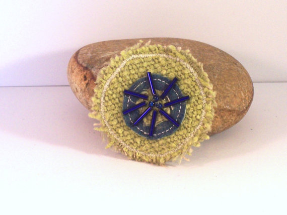 Round fabric brooch in soft lime and blue with glass beads