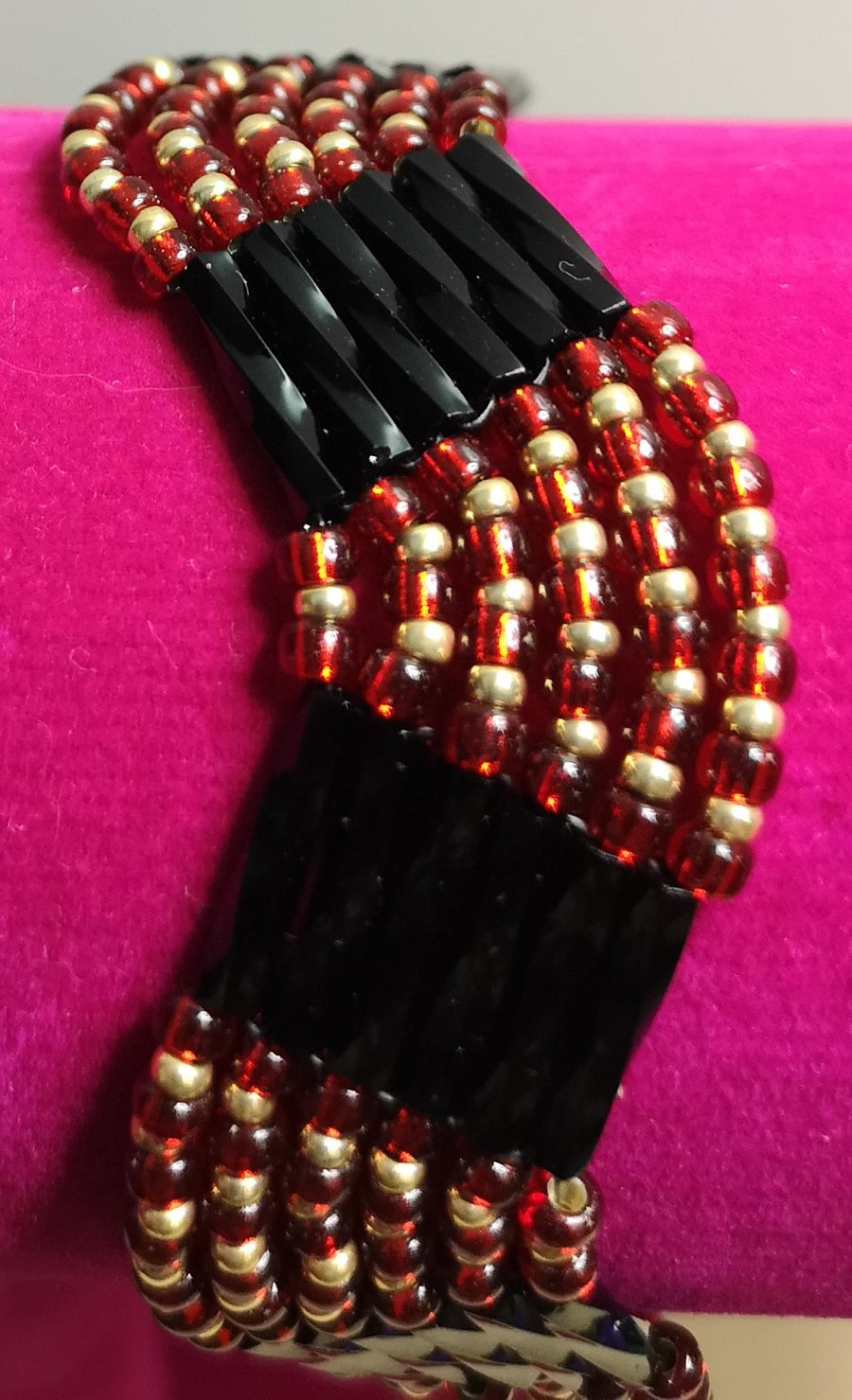 Black gold and red seed beaded bracelet