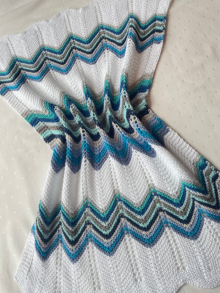 Shades of blue grey and aqua baby blanket, hand knitted in cotton yarn.