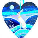 White hare with golden collar on a heart shape 