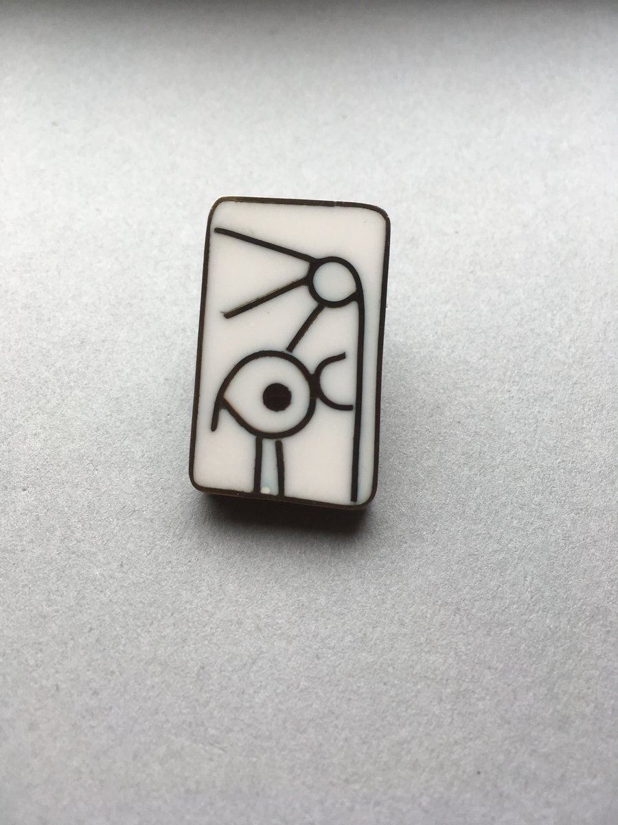 Resin and metal brooch featuring a bird. White resin oxidised metal HALF PRICE