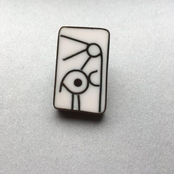 Resin and metal brooch featuring a bird. White resin oxidised metal HALF PRICE