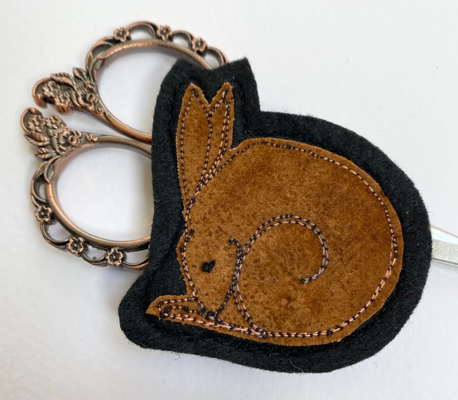 Upcycled sleeping hare brooch pin or badge. 