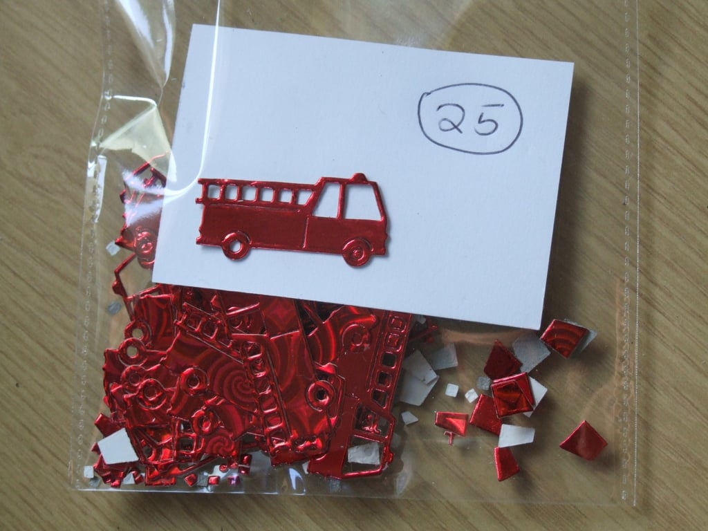25 red fire engine Sizzix die cuts for embellishing cards, table decoration.