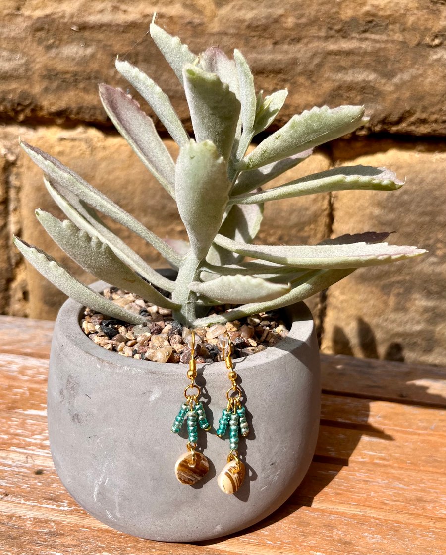 Pearlised shell and green beaded dangle earrings