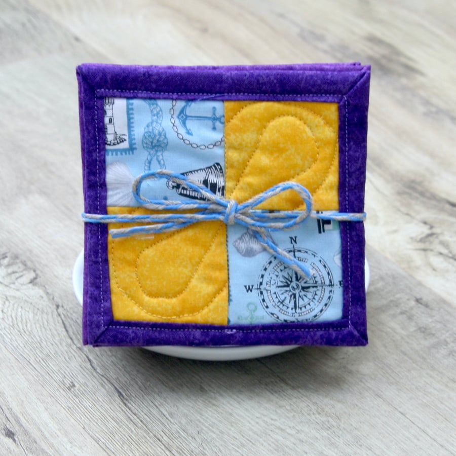 Set of Four Seaside theme yellow and purple quilted coasters