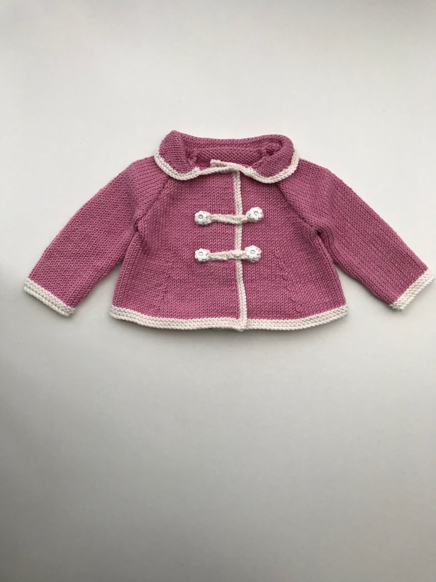 Exquisite pink baby jacket in a luxury yarn