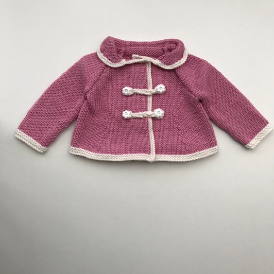 Exquisite pink baby jacket in a luxury yarn