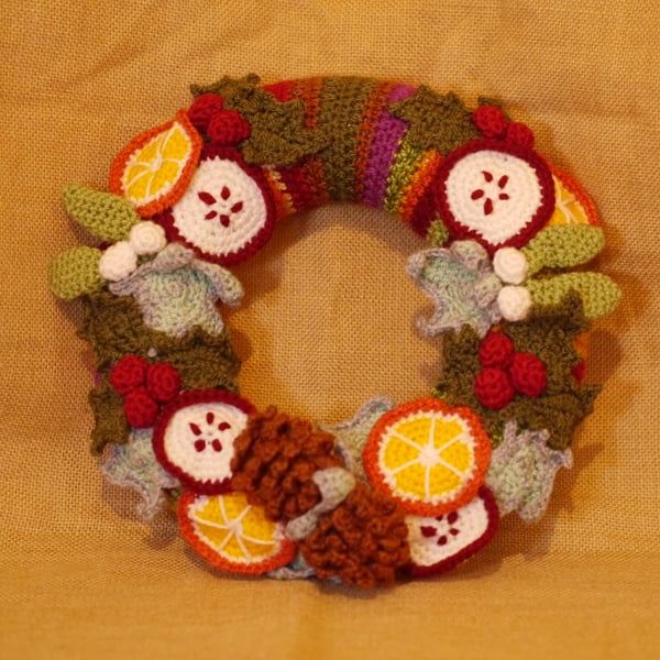 Winter Harvest Crochet Wreath, holly, ivy, pinecones, fruit. 