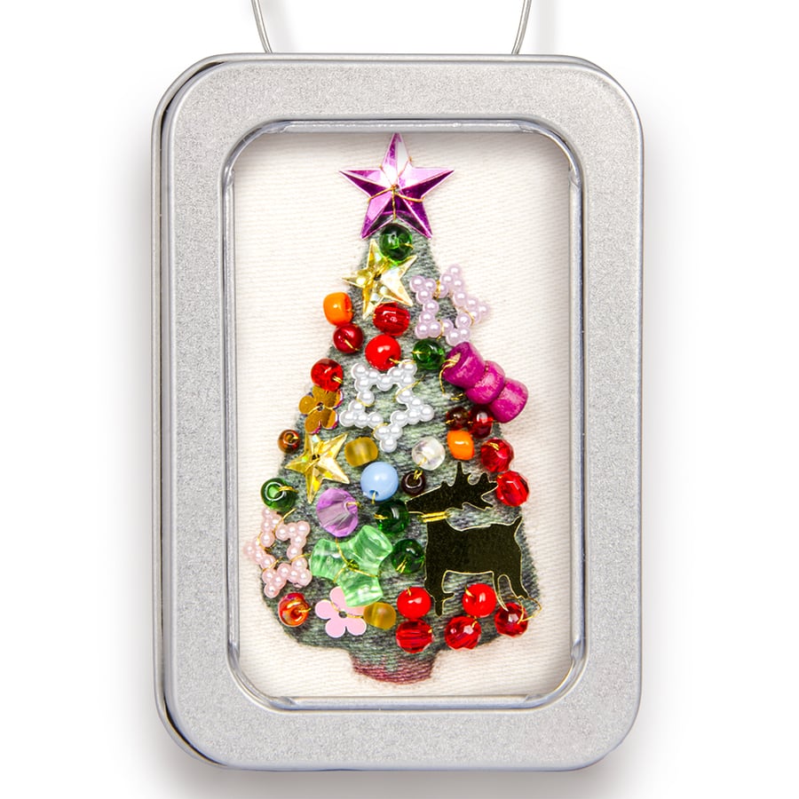 Christmas tree in a little tin with lots of decorations!